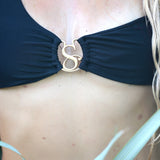 Close-up of the SBOVIA Nero Classico black single-shoulder bikini set highlighting the custom luxury metallic hardware links