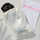 SBOVIA Nero Classico black single-shoulder bikini set inside branded packaging bag with luxury presentation