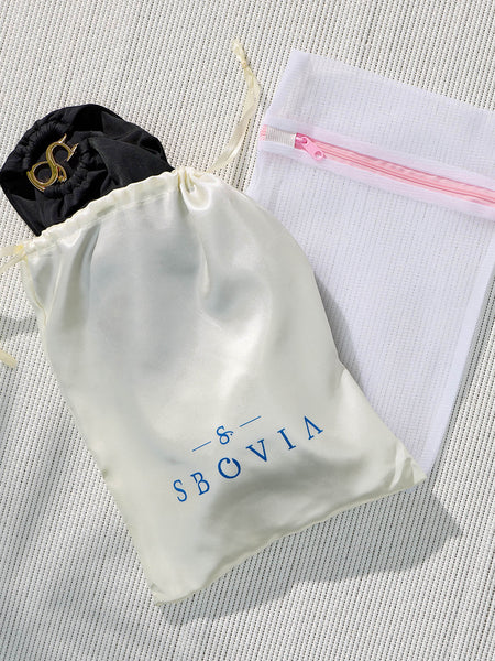 SBOVIA Nero Classico black single-shoulder bikini set inside branded packaging bag with luxury presentation